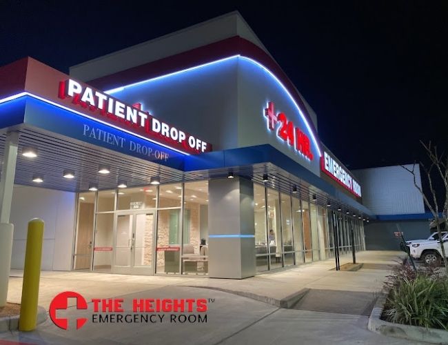 Entrance and patient drop-off canopy of The Heights Emergency Room at night