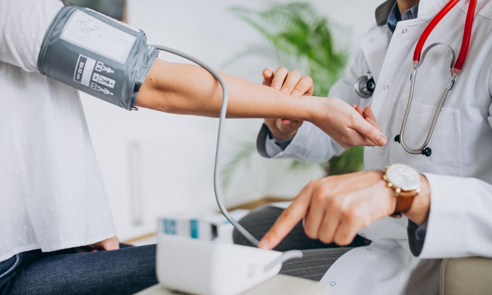Symptoms of hypertensive crisis including headache chest pain and vision changes